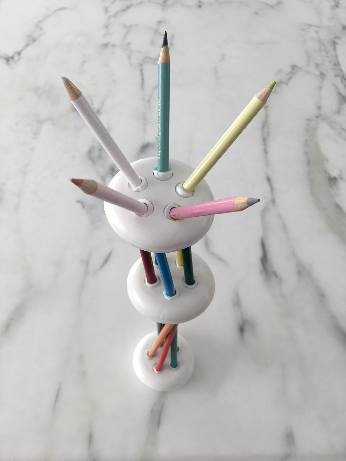 Close-up of white injection-molded pencil holders